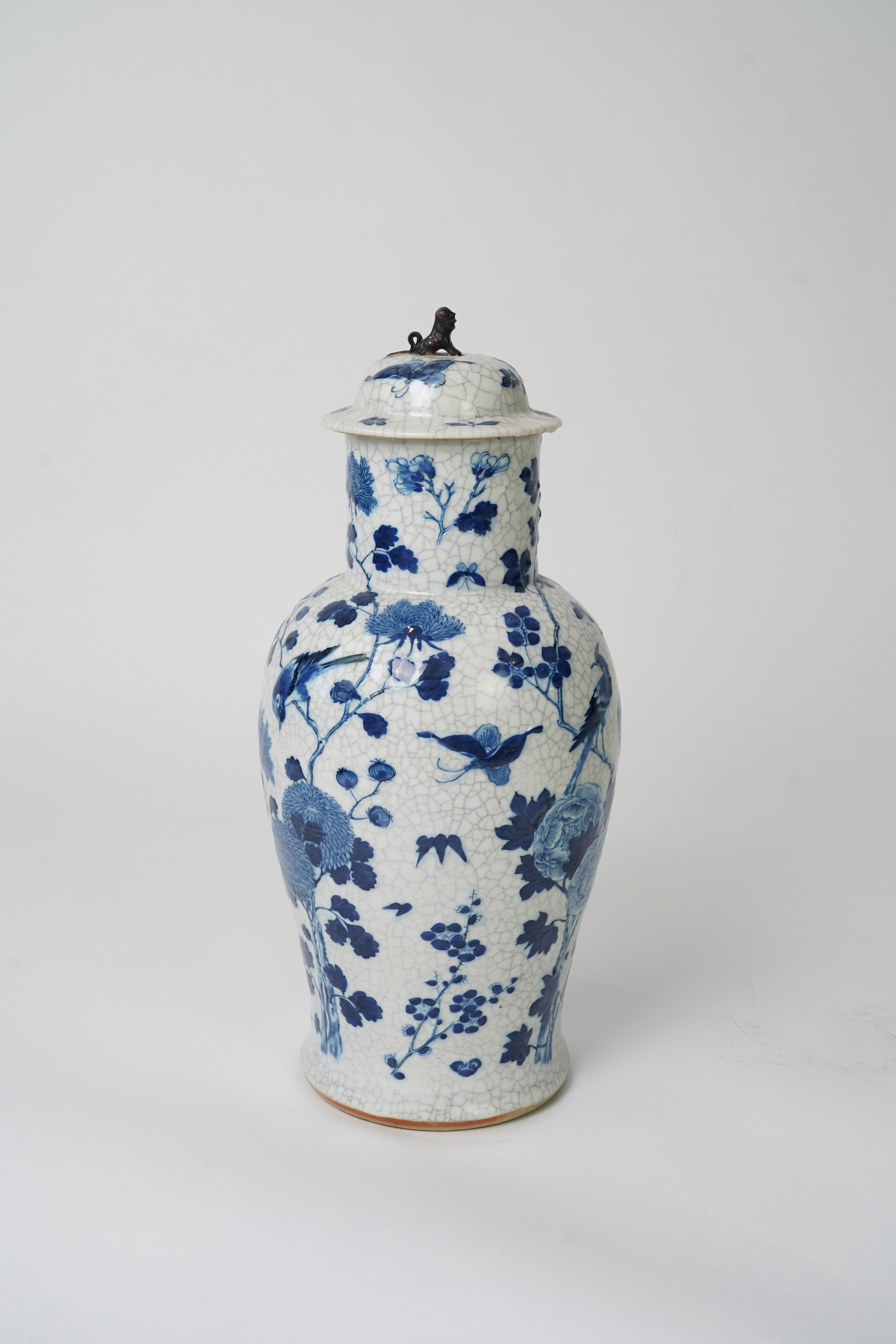 A Chinese blue and white crackle glaze baluster vase and cover, early 20th century